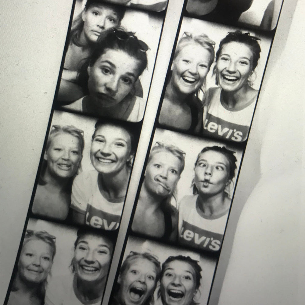 Co-Founders of Maze in vintage photobooth strips