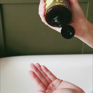 Shampoo being squeezed out of Maze bottle