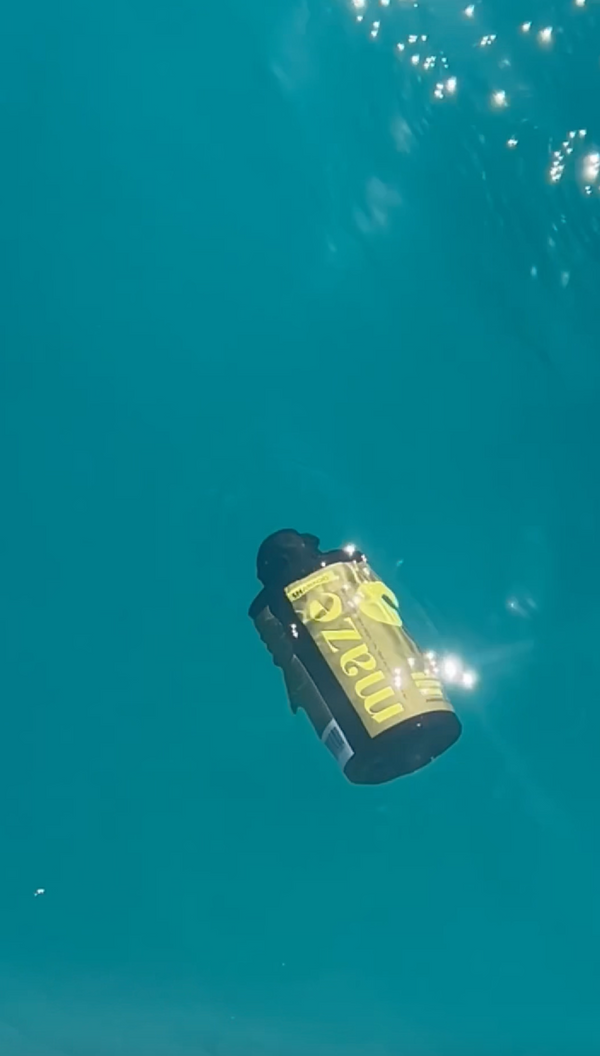 Maze bottles floating in crystal blue water